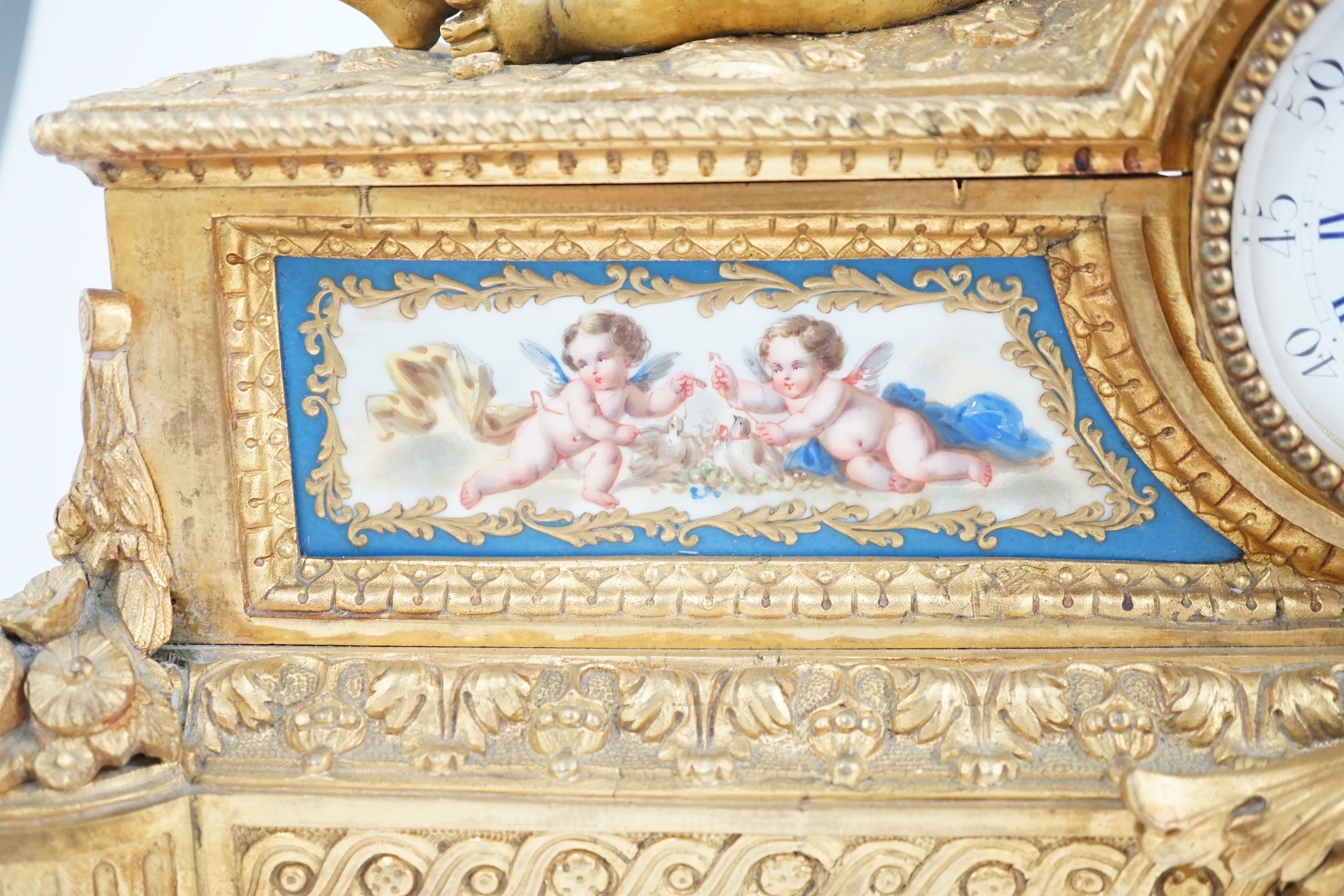 A 19th century French ormolu and Sevres style porcelain mantel clock